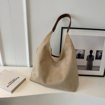 Minimalistyczna torba na ramię z szerokim paskiem do codziennego użytku